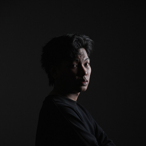 Hakim Ramiz - Professional Menstylist at Clipper Studio Taman Melawati with 7+ years experience specializing in Korean-Asian Textured Cuts, Hair Tattoos, Color Integration, Creative Cutting